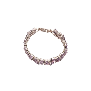 Elegant silver bracelet featuring pear-cut purple zircon stones in a classic round setting