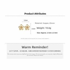 Macro view of gold flower stud earrings with zircon inlay detailing size and weight