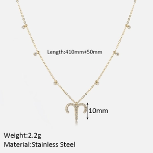Close-up of gold stainless steel Aries necklace with cubic zirconia and size details