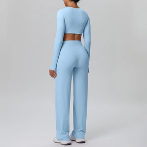 Close-up of the breathable ribbed fabric and stitching of the blue yoga tracksuit