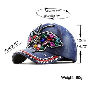 Detail view of denim baseball cap with rhinestone butterfly and size specifications