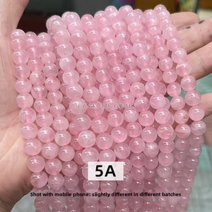 Close-up of 5A grade pink crystal round beads for DIY jewelry making and craft projects