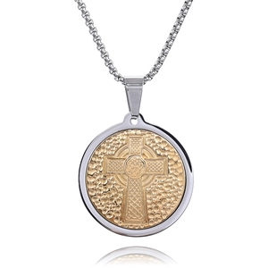 Detailed macro of a two-tone Celtic cross pendant with golden hammered finish metal