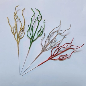 Sparkly artificial Christmas branches in gold, green, silver, and red with glitter finish