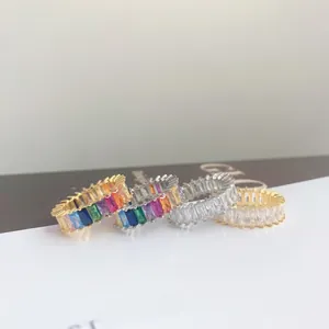 Macro detail of S925 sterling silver eternity rings with colorful baguette zircon stones
