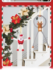 Stretching suction cup Santa and reindeer toys on a festive Christmas staircase wreath
