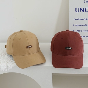 Detail of khaki and wine red cotton baseball caps with good embroidered labels