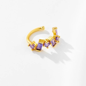Detail of 18K gold C-shaped ear cuff set with rectangular and round purple zircons