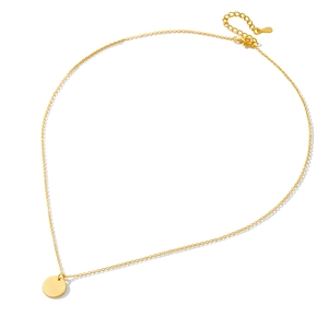 Minimalist gold plated sterling silver necklace with a round disc pendant on white background