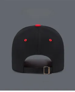 Detail view of the black canvas baseball cap back with red eyelets and metal buckle