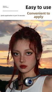 Detail of glitter freckle face patches applied to cheeks and nose with sunset beach background