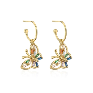 Close-up of gold butterfly earrings featuring vibrant multi-colored baguette gemstones