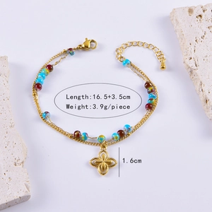 Detail of bohemian double-layer bracelet with colorful beads and flower charm