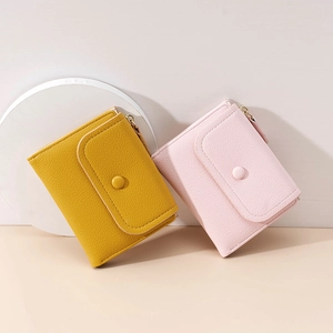 Short minimalist women's wallets in ginger and light pink with lychee grain texture