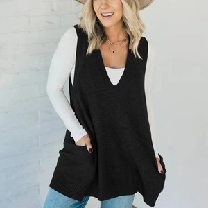 Detail of V-neck knitted vest with functional side pockets and ribbed texture