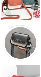 Detail of color-block flap bag featuring texture leather and striped wide strap