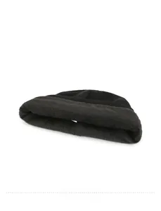 Detail of warm black knit beanie featuring thick faux fur lining for winter insulation