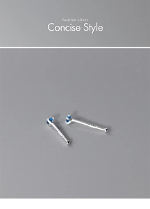 Macro detail of S925 sterling silver nose studs featuring round blue zirconia stones