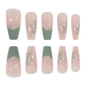 Detailed view of medium-long ballet press-on nails with camellia and pearl accents