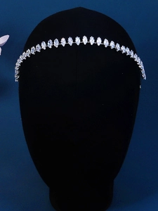 Detailed view of silver zircon headband with marquise-cut crystals on a velvet display