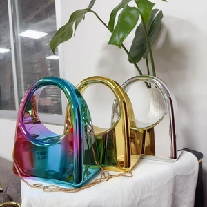 Chic acrylic evening handbags in iridescent, gold, and silver finishes with chain straps
