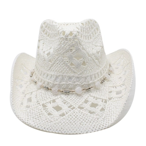 Close-up of white hollow straw cowboy hat featuring beaded chain and woven texture