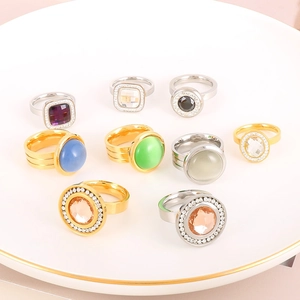 Detailed top view of luxury 18K gold-plated stainless steel rings with colorful gemstones