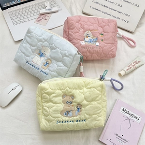 Three quilted cotton cosmetic bags with heart patterns and cute animal embroidery details