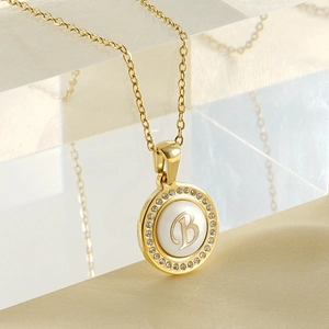 18K gold titanium steel necklace featuring a round seashell pendant with letter B and zircons