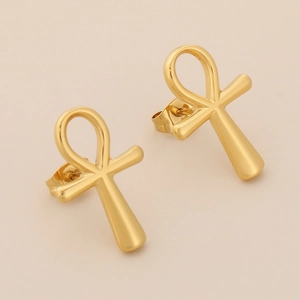Macro shot of 18K gold-plated stainless steel Ankh cross stud earrings with a polished finish