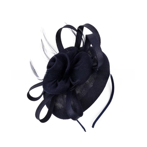 Detail of navy blue fascinator showing mesh floral layers and elegant feather accents