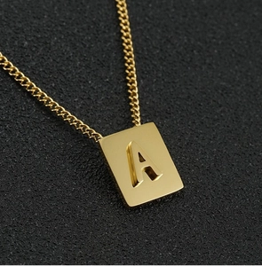Detailed close-up of 18K gold-plated stainless steel necklace with a 3D letter A pendant