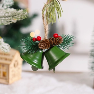 Detail of green Christmas bells with pine cones and red berries on a rustic rope
