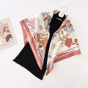 Floral print satin silk square scarf with red border hanging on camellia hanger
