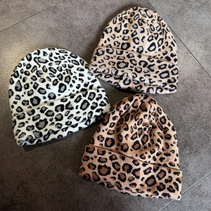 Set of three leopard print knit beanies in white, khaki and caramel warm winter colors
