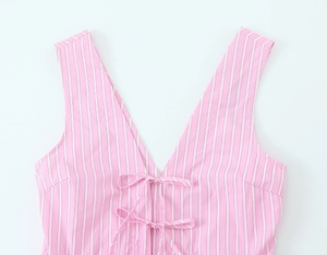 Detail of pink and white striped sleeveless top with V-neck and front bow tie closure