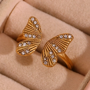 Macro shot of 18K gold plated butterfly ring with sparkling zircons in a jewelry box