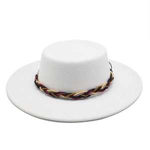 Close-up of white wool jazz hat with a colorful woven band and a wide brim detail
