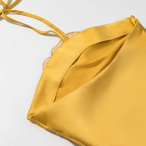Elegant yellow satin halter dress with rhinestone floral decor and wavy trim detail
