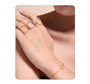 Detailed view of 18k gold plated jewelry set featuring hollow rings and zircon bracelet