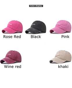 Detail view of cotton baseball caps in rose, black, pink, wine and khaki with embroidery