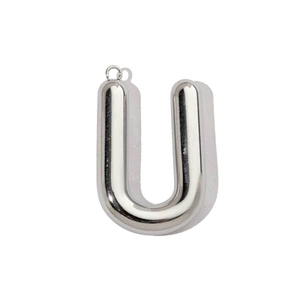 Close-up of polished silver stainless steel hollow letter U pendant with top hanging ring
