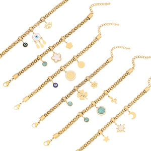 Detail view of gold stainless steel bracelets with evil eye, clover and coin charms