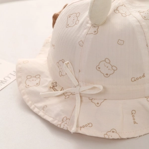 Detail of baby sun hat with cute bear print, 3D ears and adjustable drawstring tie