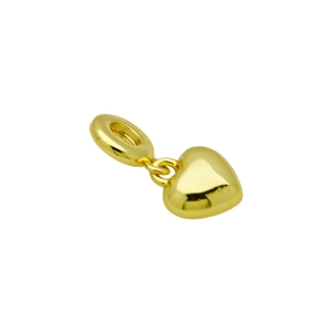 Detailed view of a polished golden heart-shaped pendant with a shiny metallic finish