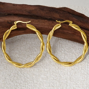 Detailed view of 304 stainless steel twisted hoop earrings with gold plated texture