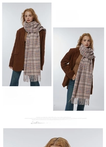 Style detail of soft beige plaid scarf with fringe paired with a brown corduroy blazer