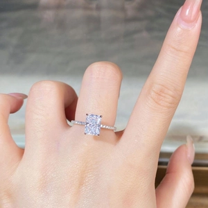 Detail of S925 silver ring featuring a rectangular ice cut zircon on a model's finger