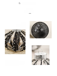 Close-up of painted PET Christmas balls with black glitter lines and snowflake silver caps