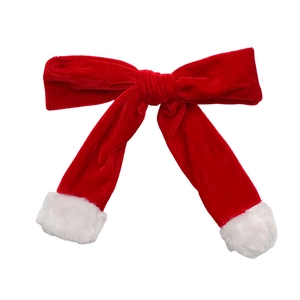 Christmas red velvet bow hair clip with white plush edges for elegant festive hairstyling